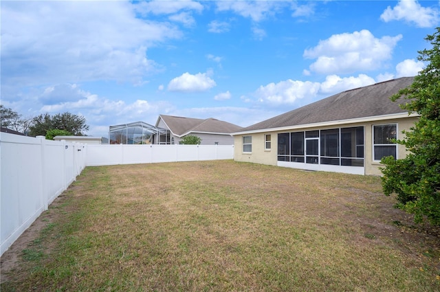 view of yard with a sunroom