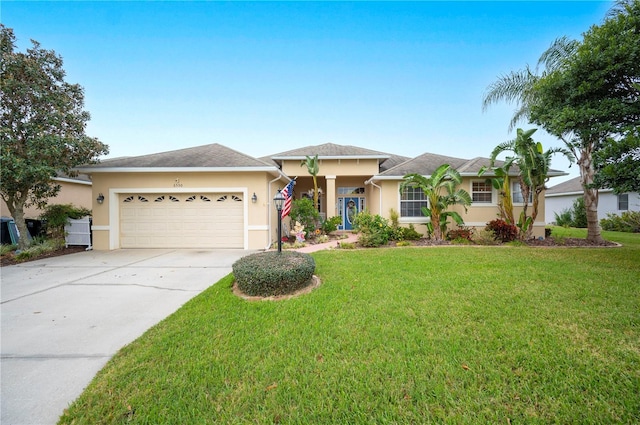 ranch-style home with a garage and a front yard