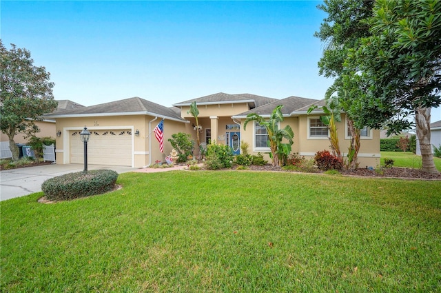 view of front of house with a garage and a front yard