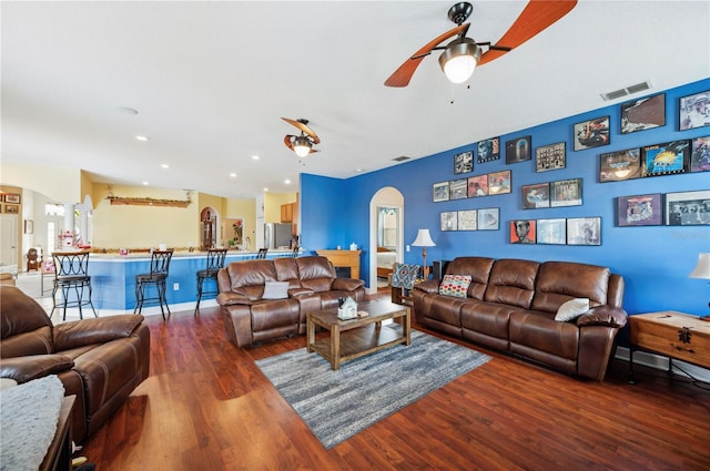 living room with ceiling fan and hardwood / wood-style floors