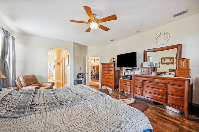 bedroom with dark wood-type flooring and ceiling fan