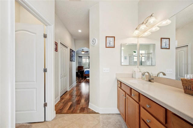 bathroom featuring tile patterned flooring and vanity