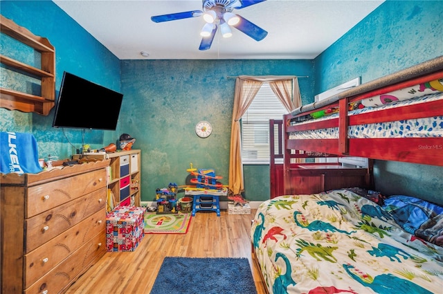 bedroom featuring ceiling fan and hardwood / wood-style flooring