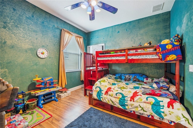 bedroom featuring ceiling fan and hardwood / wood-style floors