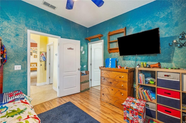 bedroom featuring ceiling fan and hardwood / wood-style flooring