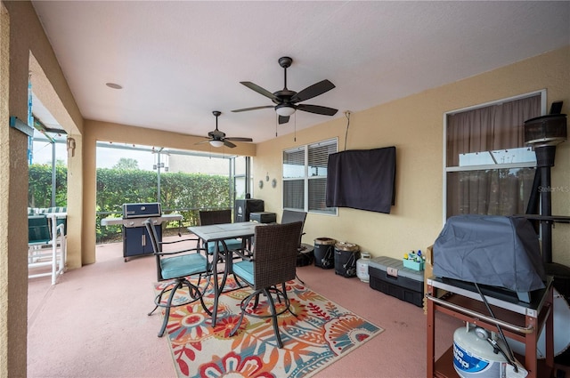 view of patio / terrace with area for grilling and ceiling fan