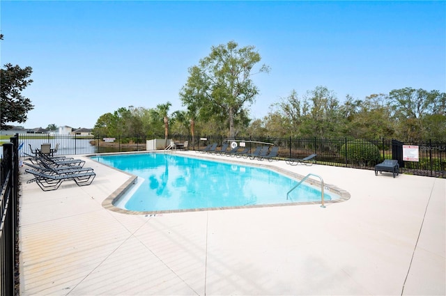 view of pool featuring a patio area