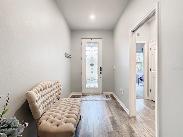 foyer with light wood-type flooring