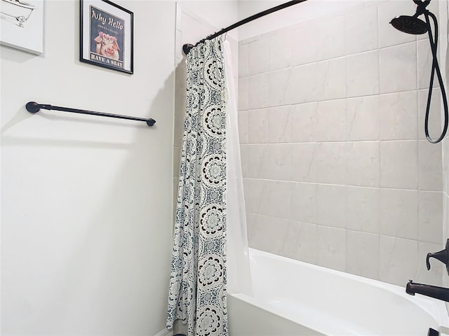 bathroom with shower / tub combo with curtain