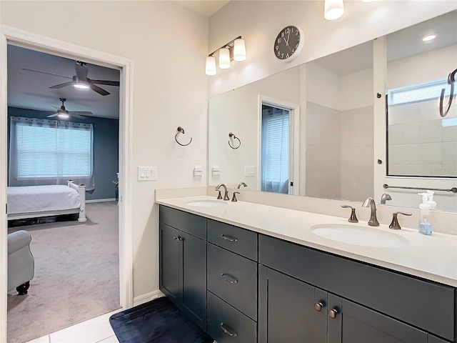 bathroom with tile patterned flooring, ceiling fan, and vanity