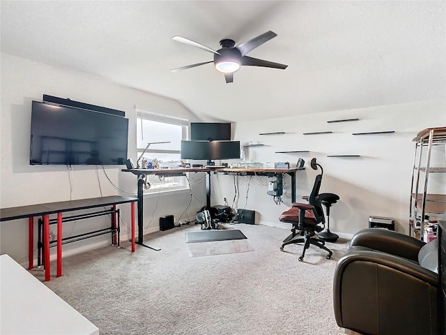 workout area featuring ceiling fan, carpet floors, and lofted ceiling