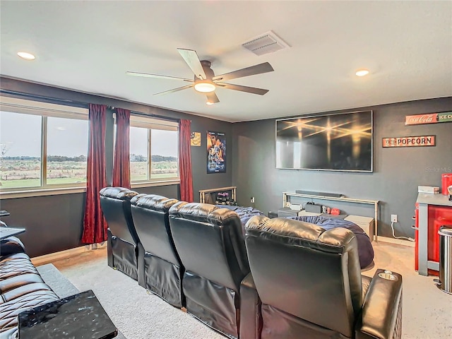 home theater room with ceiling fan