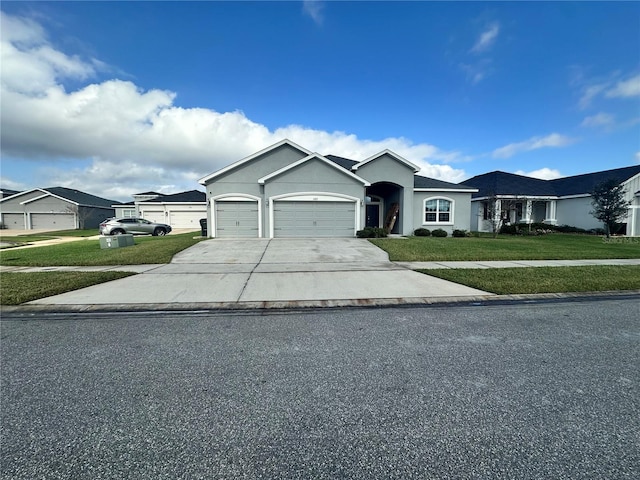 ranch-style house with a garage and a front yard