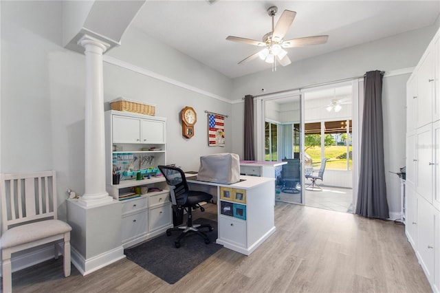 home office featuring ornate columns, ceiling fan, and light hardwood / wood-style flooring