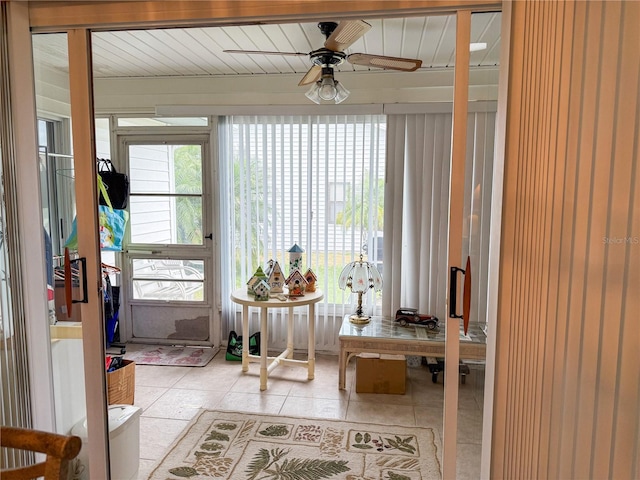 entrance foyer with a wealth of natural light, ceiling fan, and light tile patterned floors