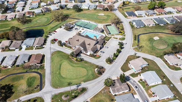 aerial view with view of golf course and a residential view
