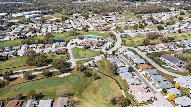 aerial view featuring view of golf course and a residential view