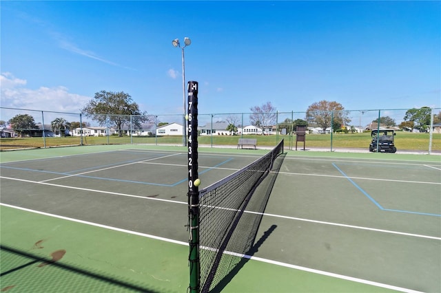 view of sport court featuring community basketball court and fence