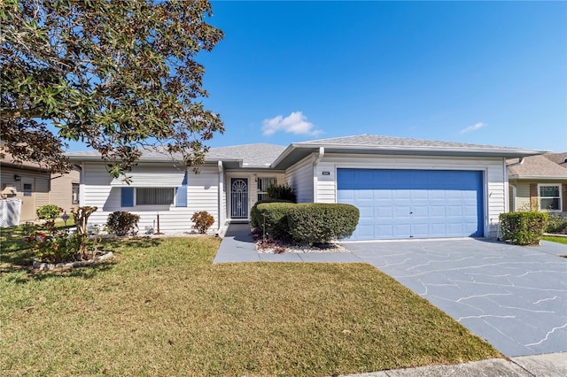 single story home featuring driveway, a garage, roof with shingles, and a front lawn