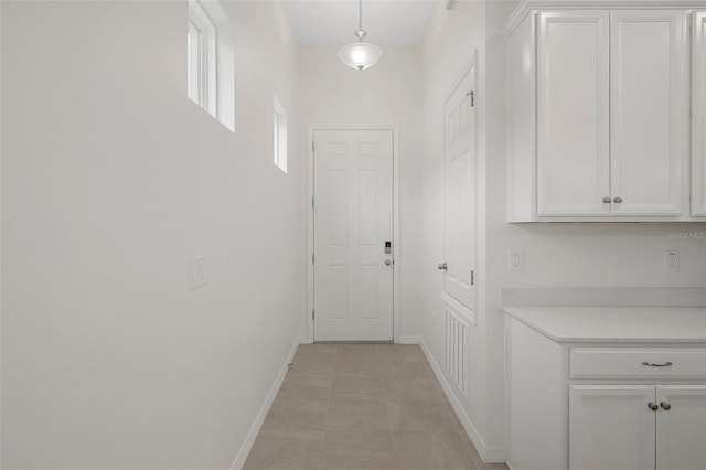 hallway featuring light tile patterned floors