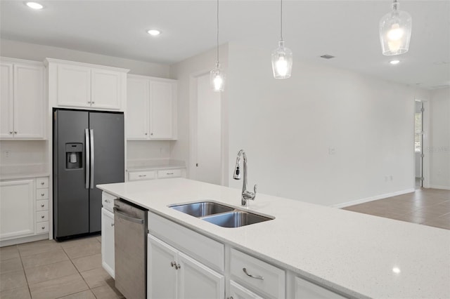 kitchen featuring sink, white cabinetry, appliances with stainless steel finishes, and light tile patterned flooring