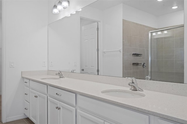 bathroom featuring vanity, walk in shower, and tile patterned flooring