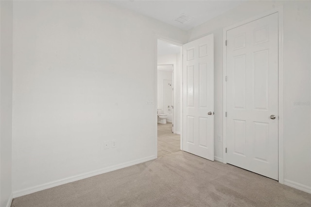 unfurnished bedroom with light carpet