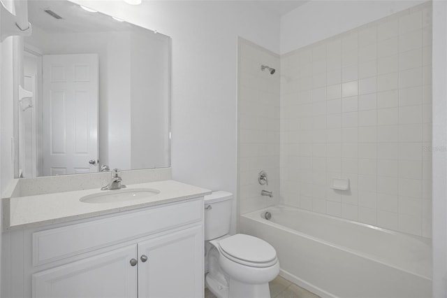 full bathroom with vanity, toilet, tile patterned flooring, and tiled shower / bath combo