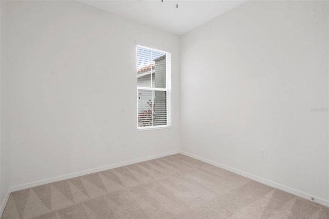 empty room featuring light colored carpet