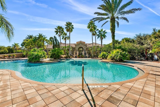 view of swimming pool with a patio