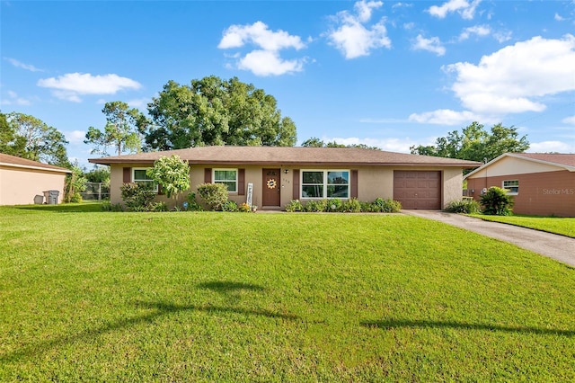 single story home featuring driveway, an attached garage, a front lawn, and stucco siding