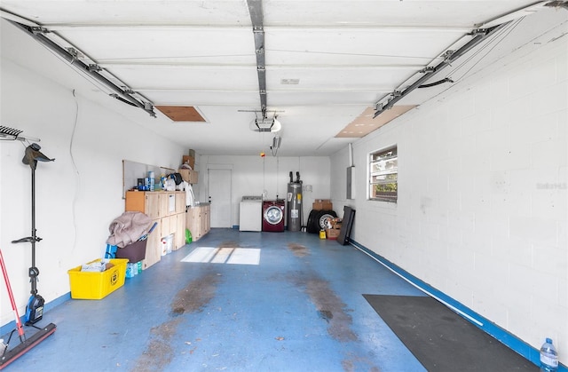 garage featuring a garage door opener and water heater