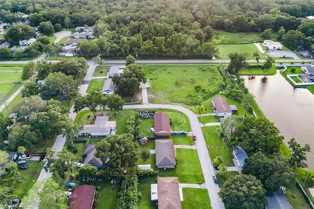 drone / aerial view featuring a water view and a residential view