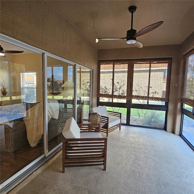 sunroom with a ceiling fan