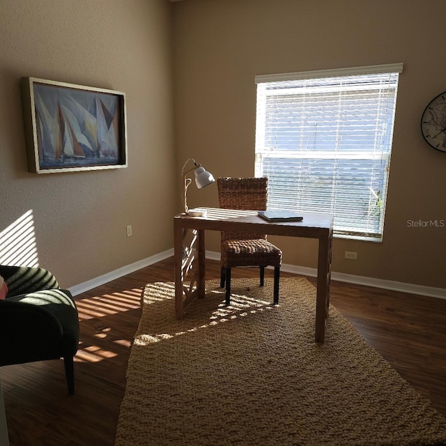 office featuring dark wood-type flooring and baseboards