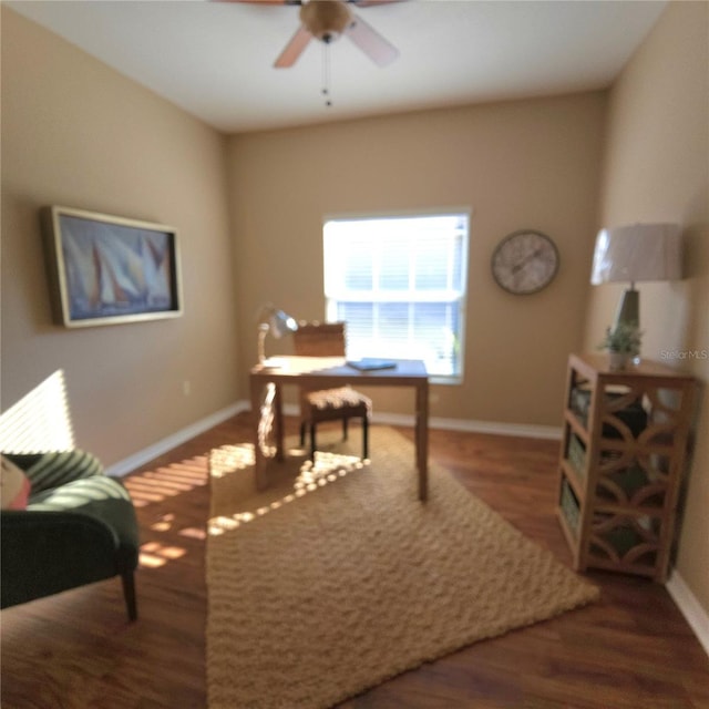 office space with ceiling fan, baseboards, and wood finished floors