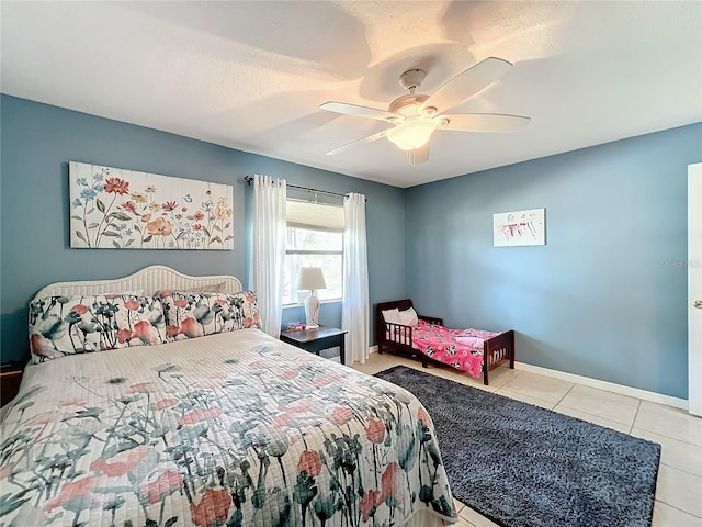 tiled bedroom with ceiling fan