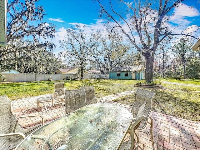 view of patio with an outbuilding