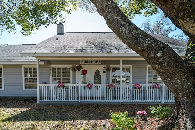 rear view of house with a porch