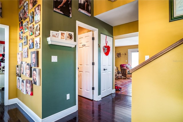 corridor featuring dark hardwood / wood-style flooring