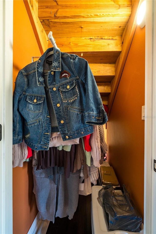 spacious closet featuring beamed ceiling