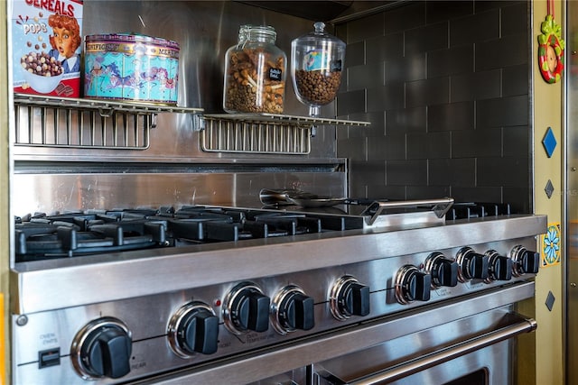 details with high end stainless steel range and backsplash