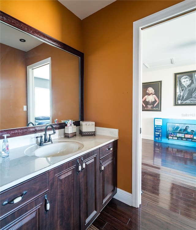 bathroom featuring hardwood / wood-style floors and vanity