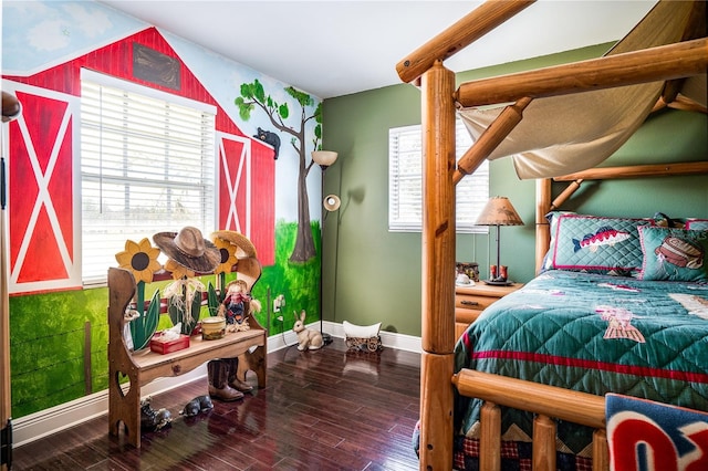 bedroom featuring multiple windows and dark hardwood / wood-style floors