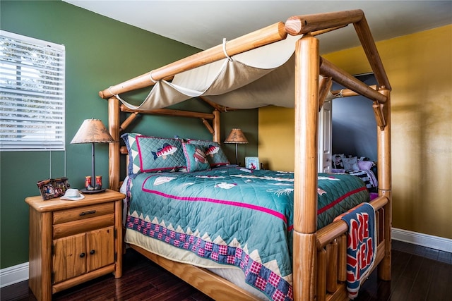 bedroom featuring dark hardwood / wood-style floors