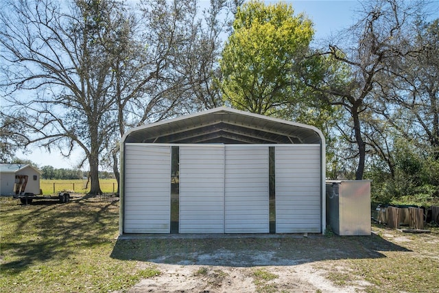 view of outdoor structure with a yard