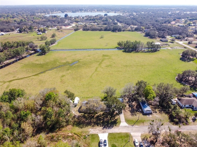 birds eye view of property featuring a rural view