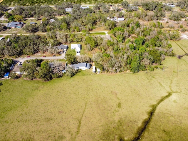 birds eye view of property featuring a rural view