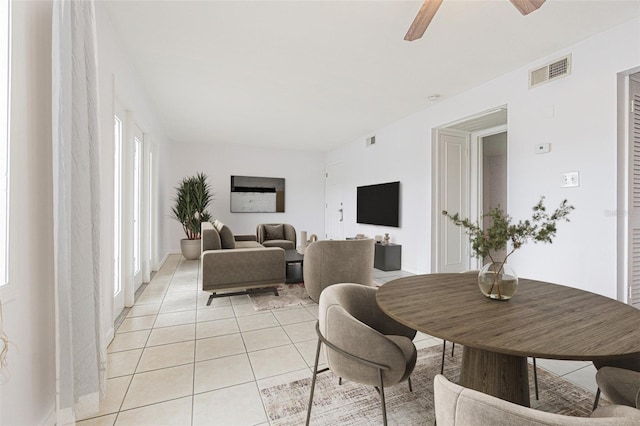 dining room featuring light tile patterned flooring and ceiling fan