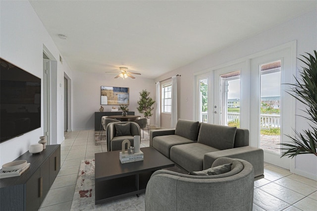 tiled living room with ceiling fan